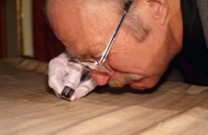 Dr Ray Rogers inspecting the image with a magnifying glass